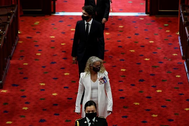 Gov. Gen. Julie Payette, followed by Prime Minister Justin Trudeau, arrives for the throne speech in the Senate chamber in Ottawa, Wednesday, Sept. 23, 2020. THE CANADIAN PRESS/Justin Tang