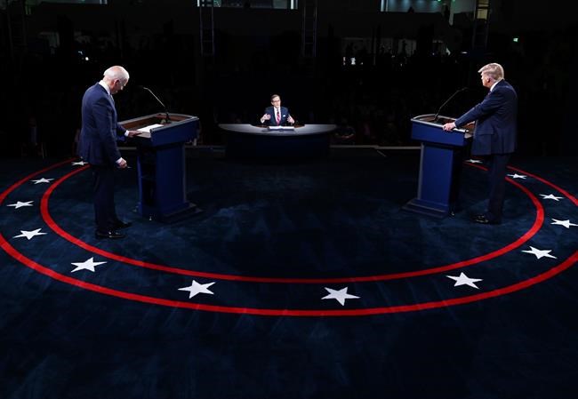 President Donald Trump and Democratic presidential candidate former vice-president Joe Biden participate in the first presidential debate Tuesday, Sept. 29, 2020, at Case Western University and Cleveland Clinic, in Cleveland. THE CANADIAN PRESS/AP-Olivier Douliery/Pool vi AP