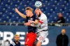 New England Revolution's Adam Buksa (9) and Toronto FC's Laurent Ciman (26) go for a head ball during the first half of an MLS soccer match Wednesday, Oct. 7, 2020, in Foxborough, Mass. THE CANADIAN PRESS/AP-Steven Senne