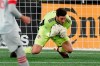 Toronto FC goalkeeper Alex Bono makes a save during the second half of the team's MLS soccer match against the New England Revolution, Wednesday, Oct. 7, 2020, in Foxborough, Mass. THE CANADIAN PRESS/AP/Steven Senne
