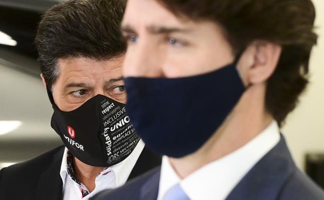 Prime Minister Justin Trudeau and National President of Unifor Jerry Dias hold a press conference at the Ford Connectivity and Innovation Centre in Ottawa on Thursday, Oct. 8 2020. THE CANADIAN PRESS/Sean Kilpatrick