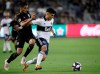 Vancouver Whitecaps forward Fredy Montero, right, fends off Los Angeles FC defender Mohamed El-Munir during the second half of a Major League Soccer match in Los Angeles, Saturday, July 6, 2019. The ‘Caps will look to atone for last month’s ugly 6-0 thrashing on Wednesday when they host LAFC at their temporary home in Portland. THE CANADIAN PRESS/AP-Alex Gallardo