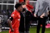 Toronto FC head coach Greg Vanney, right, talks with Richie Laryea during the first half of an MLS soccer match against the New York Red Bulls, Wednesday, Oct. 14, 2020, in East Hartford, Conn. (AP Photo/Jessica Hill)