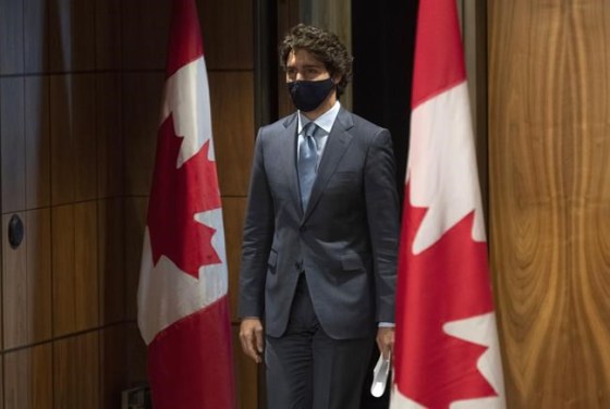 Prime Minister Justin Trudeau arrives for a news conference Tuesday Oct. 20, 2020 in Ottawa. Trudeau is urging Canadians to adhere to local health guidelines when considering how to celebrate Halloween next week, acknowleding that not trick-or-treating will be hard on many kids. THE CANADIAN PRESS/Adrian Wyld