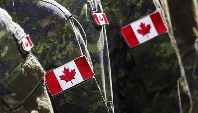Members of the Canadian Armed Forces march during the Calgary Stampede parade in Calgary, Friday, July 8, 2016. THE CANADIAN PRESS/Jeff McIntosh