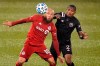 Toronto FC's Nick DeLeon, left, eyes the ball as Inter Miami's Alvas Powell, right, defends during the first half of an MLS match, Sunday, Nov. 1, 2020, in East Hartford, Conn. (AP Photo/Jessica Hill)