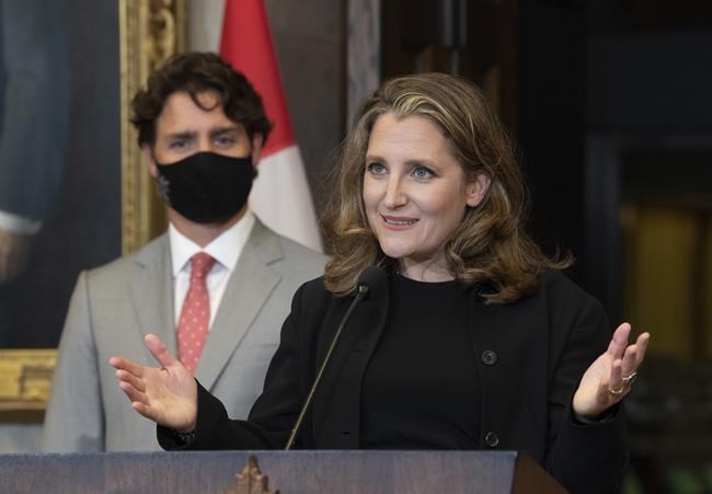 Prime Minister Justin Trudeau looks on as Deputy Prime Minister and Finance Minister Chrystia Freeland responds to a question during a news conference on Parliament Hill in Ottawa, Tuesday, Aug. 18, 2020. The federal government has introduced a long-awaited bill to provide businesses with direct access to emergency rent relief -- almost a month after announcing the new measure. THE CANADIAN PRESS/Adrian Wyld