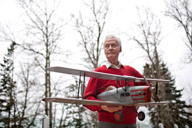 Max Ward pictured with a model of his first plane, the De Havilland Fox Moth CF-DJB, in Edmonton on Tuesday November 17, 2015. Max Ward, an aviation pioneer who went from bush planes to international charters, has died. Family friend Jacquie Perrin says Ward collapsed at his home in Edmonton and died shortly after in hospital, surrounded by his family and 20 days short of his 99th birthday. THE CANADIAN PRESS/Jason Franson