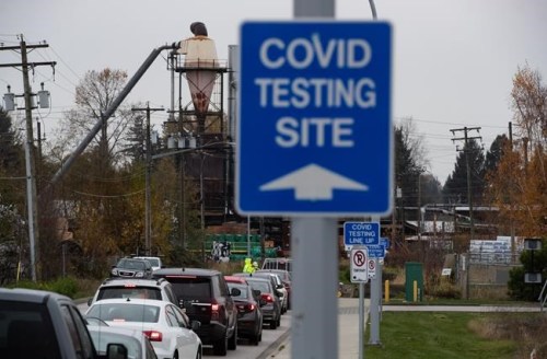 Motorists wait to enter a Fraser Health COVID-19 testing facility, in Surrey, B.C., on Monday, Nov. 9, 2020. THE CANADIAN PRESS/Darryl Dyck