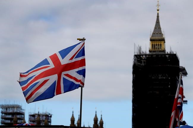 The Union flag flies above a souvenir stand in front of Big Ben in London, Friday, Oct. 16, 2020. Canada and Britain say they are in the final stages of negotiating a new trade deal before a Dec. 31 deadline. THE CANADIAN PRESS/AP, Kirsty Wigglesworth