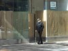 A pedestrian walks past a closed storefront on St. Catherine street as the COVID-19 pandemic continues to take its toll on local businesses, Thursday, Oct. 8, 2020 in Montreal. THE CANADIAN PRESS/Ryan Remiorz