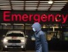 A person wears a protective face mask to help prevent the spread of COVID-19 as they walk past the emergency department of the Vancouver General Hospital, in Vancouver, B.C., Wednesday, Nov. 18, 2020. Federal opposition leaders have been given an advance look at grim new projections for the spread of COVID-19 in Canada. THE CANADIAN PRESS/Jonathan Hayward