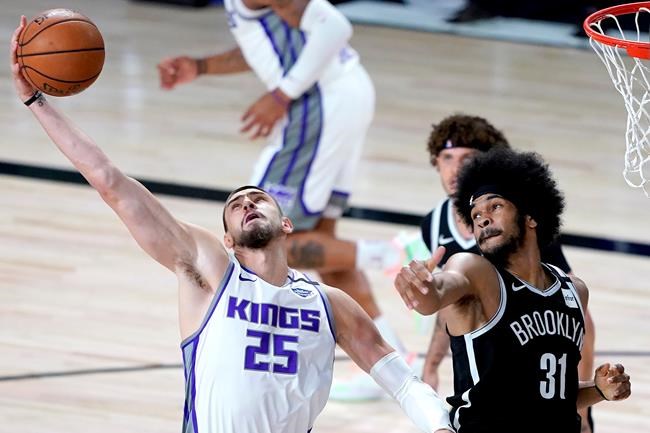 Sacramento Kings' Alex Len (25) collects a rebound against Brooklyn Nets' Jarrett Allen (31) during the first half of an NBA basketball game Friday, Aug. 7, 2020 in Lake Buena Vista, Fla. THE CANADIAN PRESS/AP, Ashley Landis