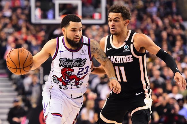 Toronto Raptors guard Fred VanVleet (23) brings the ball up court against Atlanta Hawks guard Trae Young (11) during the first half of NBA basketball action in Toronto on January 28, 2020. The Raptors officially annoucned that VanVleet has agreed to a multi-year contract with the team. THE CANADIAN PRESS/Frank Gunn