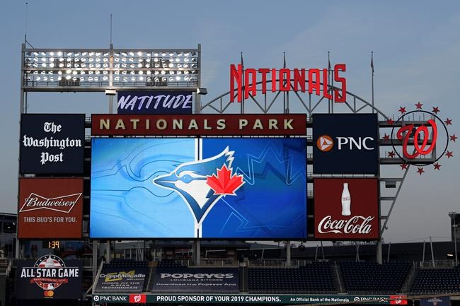 The Toronto Blue Jays' logo is displayed on the scoreboard during the middle of the eighth inning of the team's baseball game against the Washington Nationals, in Washington, Wednesday, July 29, 2020. Rogers Sportsnet is parting ways with veteran Blue Jays radio announcer Mike Wilner. THE CANADIAN PRESS/AP-Nick Wass
