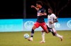 New England Revolution forward Tajon Buchanan (17) works the ball past Philadelphia Union midfielder Jamiro Monteiro during the first half of an MLS soccer match, Saturday, July 25, 2020, in Kissimmee, Fla. THE CANADIAN PRESS/AP, John Raoux