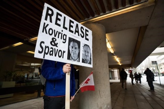 A young man holds a sign bearing photographs of Michael Kovrig and Michael Spavor, who have been detained in China for more than a year, outside B.C. Supreme Court where Huawei chief financial officer Meng Wanzhou was attending a hearing, in Vancouver, on Tuesday January 21, 2020. In his darkest moments, Michael Kovrig draws strength from knowing that his fellow Canadians and people around the world are working to free him and Michael Spavor from their respective Chinese prison cells. THE CANADIAN PRESS/Darryl Dyck