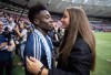 Vancouver Whitecaps' Alphonso Davies, left, receives a hug from Canadian women's national soccer team forward Jordyn Huitema after playing his final match as a member of the MLS soccer team, in Vancouver, B.C., Sunday, Oct. 28, 2018. A photo of Davies and Huitema on Instagram while enjoying a vacation in Spain drew more than 14,000 comments, including some that were offensive. Many more decried the racist comments. THE CANADIAN PRESS/Darryl Dyck