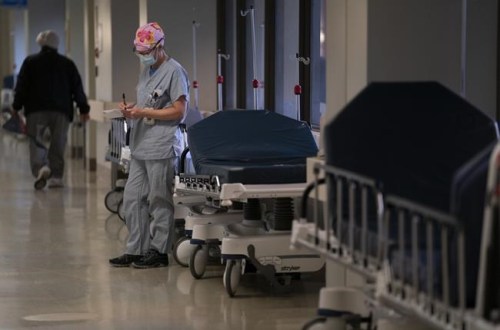 ICU nurse Sophie Gabiniewicz takes a moment to herself to write some notes during her shift at St. Paul’s Hospital in downtown Vancouver, Friday, December 4, 2020. Front-line workers have been named the 2020 Newsmaker of the Year in a survey of news editors across the country by The Canadian Press.THE CANADIAN PRESS/Jonathan Hayward