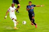 Olimpia midfielder Deybi Flories, left, clears the ball past Montreal Impact forward Mason Toye (13) during the first half of a CONCACAF Champions League soccer match, Tuesday, Dec. 15, 2020, in Orlando, Fla. THE CANADIAN PRESS/AP, John Raoux