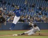 New York Yankees DJ LeMahieu is safe stealing third base as Toronto Blue Jays Richard Urena leaps for the throw from catcher Reese McGuire in the seventh inning of their American League baseball game in Toronto, Sunday, September 15, 2019. THE CANADIAN PRESS/Fred Thornhill