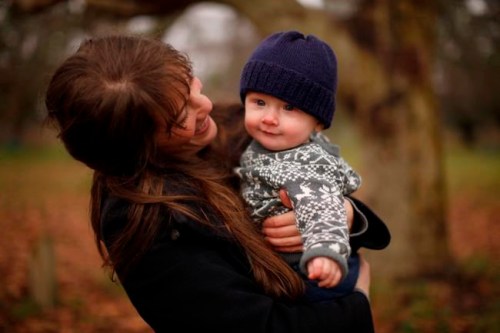 New mother Madeleine Shaw shares a moment with her son George Shaw-Macdonald while at Beacon Hill Park in Victoria, B.C., on Friday, December 18, 2020. THE CANADIAN PRESS/Chad Hipolito