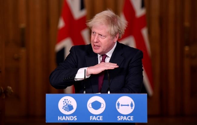 Britain's Prime Minister Boris Johnson speaks during a news conference in response to the ongoing situation with the coronavirus (COVID-19) pandemic, inside 10 Downing Street, London, Saturday, Dec. 19, 2020. THE CANADIAN PRESS/Toby Melville/Pool Photo via AP)