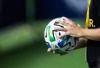 A Vancouver Whitecaps staff member sanitizes a ball that went out of play with a disinfectant wipe as the Whitecaps and Toronto FC play during the first half of an MLS soccer match in Vancouver, on Saturday, September 5, 2020. Less than a year after agreeing to a new five-year collective bargining agreement, Major League Soccer and the players union are heading back to the bargining table. THE CANADIAN PRESS/Darryl Dyck