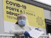A nheath-care worker waits for patients at a COVID-19 test clinic in Montreal, on Friday, December 11, 2020. THE CANADIAN PRESS/Paul Chiasson