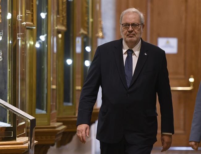 Quebec Liberal Pierre Arcand walks to a news conference as the legislature resumes Tuesday, Feb. 4, 2020, at the Quebec legislature in Quebec City. The Quebec Liberal party has stripped Arcand of his roles in its shadow cabinet after a controversial trip to Barbados during the holidays. THE CANADIAN PRESS/Jacques Boissinot