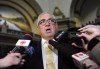 Joe Hargrave speaks to reporters following the throne speech at the Legislative Building in Regina on Wednesday, Oct. 25, 2017. The Saskatchewan highways minister has been the focus of Opposition criticism after it was revealed he travelled to California during the holidays. THE CANADIAN PRESS/Mark Taylortravelle