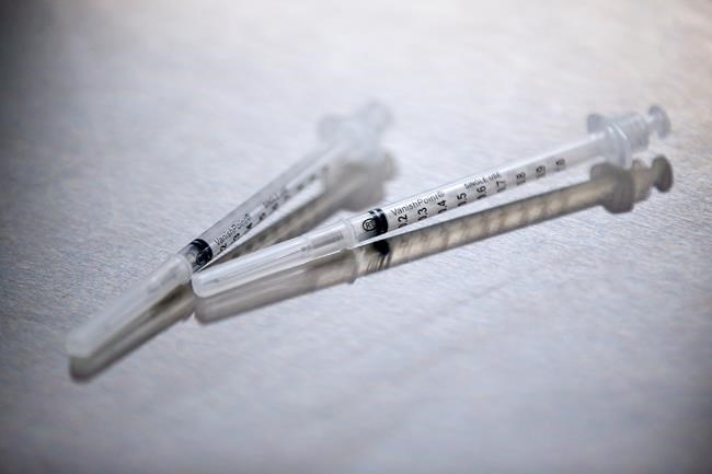 A typical vaccination station at the COVID-19 vaccination clinic at the Health Sciences Centre in Winnipeg on December 14, 2020. THE CANADIAN PRESS/John Woods