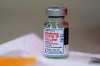 A bottle of Moderna's COVID-19 vaccine is seen on a table before Kansas Democratic Gov. Laura Kelly received an injection in Topeka, Kan., on Dec. 30, 2020. THE CANADIAN PRESS/AP, Charlie Riedel