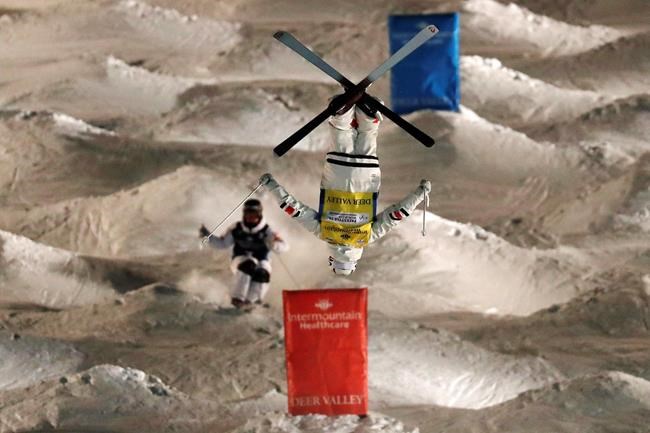 Mikael Kingsbury, of Canada, front, races in the finals against Benjamin Cavet, of France, during the World Cup men's freestyle dual moguls skiing event Saturday, Feb. 8, 2020, in Park City, Utah. THE CANADIAN PRESS/AP/Jeff Swinger