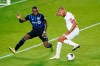 Montreal Impact defender Zachary Brault-Guillard, left, blocks a shot on goal attempt by Olimpia forward Eddie Hernandez during the second half of a CONCACAF Champions League soccer match, Tuesday, Dec. 15, 2020, in Orlando, Fla. The Montreal Impact are rebranding, changing the Major League Soccer club's moniker to Club De Foot Montreal — or CF Montreal.THE CANADIAN PRESS/AP/John Raoux