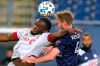 Toronto FC's Ayo Akinola, left, vies for control of the ball with New England Revolution's Henry Kessler during the second half of an MLS soccer match, Wednesday, Oct. 7, 2020, in Foxborough, Mass. Akinola scored in the first half to help Toronto FC win 1-0. THE CANADIAN PRESS/AP-Steven Senne