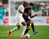 Canada forward Cyle Larin, left, vies for the ball with Mexico defender Nestor Araujo during the second half of a CONCACAF Gold Cup soccer match Wednesday, June 19, 2019, at Mile High Stadium in Denver. THE CANADIAN PRESS/AP, David Zalubowski