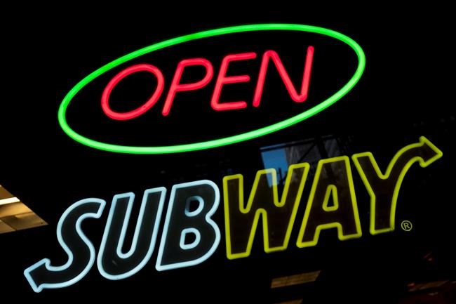 A Subway fast food restaurant's sign is shown in New York on Oct. 24, 2016. A defamation lawsuit by the world’s largest fast-food operator against Canada's public broadcaster over a report on the chain's chicken sandwiches can proceed, Ontario's top court has ruled. THE CANADIAN PRESS/AP, Mark Lennihan