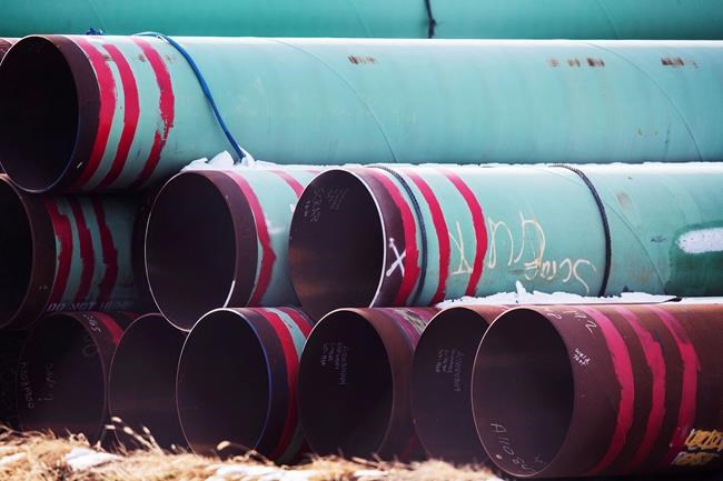 In this Dec. 18, 2020 photo, pipes to be used for the Keystone XL pipeline are stored in a field near Dorchester, Neb. THE CANADIAN PRESS/AP-Chris Machian /Omaha World-Herald via AP