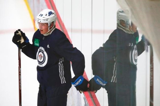Winnipeg Jets' Patrik Laine looks on during the first day of the Jets NHL summer training camp as the NHL reopens during COVID-19 in Winnipeg, Monday, July 13, 2020. The Jets have placed forwards Laine and Nate Thompson on injured reserve. THE CANADIAN PRESS/John Woods