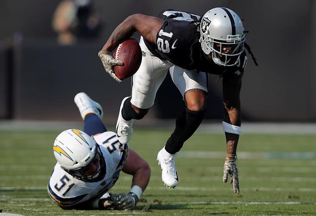 Oakland Raiders wide receiver Martavis Bryant (12) runs past Los Angeles Chargers linebacker Kyle Emanuel (51) during the first half of an NFL football game in Oakland, Calif., Sunday, Nov. 11, 2018. The Toronto Argonauts have signed former Pittsburgh Steelers and Oakland wide receiver Bryant, who has been suspended multiple times by the NFL.THE CANADIAN PRESS/AP /John Hefti