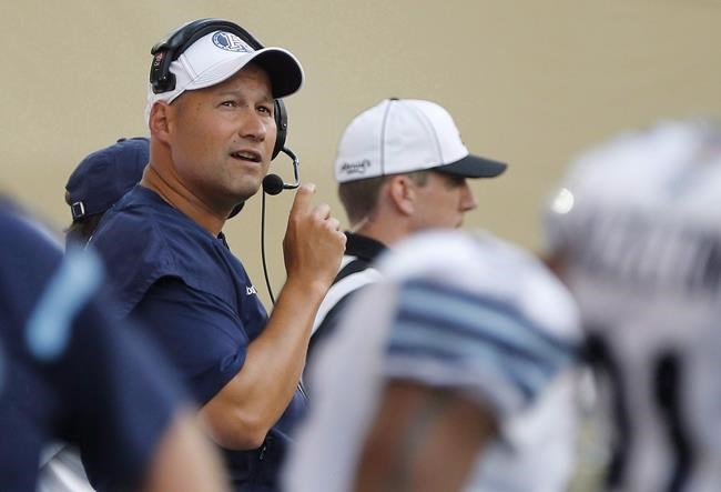 Toronto Argonauts head coach Scott Milanovich calls the plays on the sideline against Winnipeg Blue Bombers during the first half of CFL action in Winnipeg on August 14, 2015. THE CANADIAN PRESS/John Woods