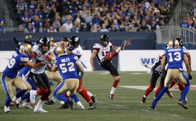 Ottawa Redblacks Richie Leone (13) kicks against the Winnipeg Blue Bombers during the second half of CFL action in Winnipeg on August 17, 2018. THE CANADIAN PRESS/John Woods
