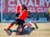 Hamilton Forge's Kyle Bekker, right, falls beside Calgary Cavalry's Jordan Brown during Canadian Premier League soccer finals action in Calgary on November 2, 2019.THE CANADIAN PRESS/Jeff McIntosh