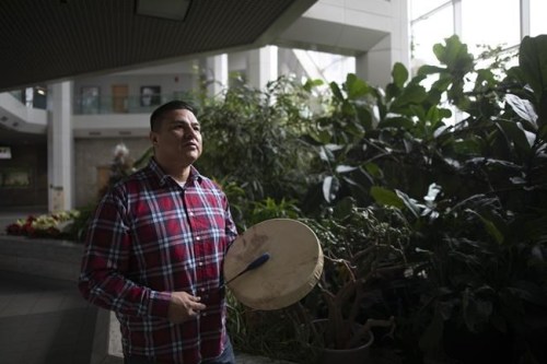 Young Spirit Singers co-founder Jacob Faithful stands for a portrait inside the University of Saskatchewan in Saskatoon on Sunday, Jan. 20, 2019. Faithful, a member of the Frog Lake First Nations in Alberta, is opening the first mask manufacturing plant on a Canadian reserve that is fully owned and operated by Indigenous people. THE CANADIAN PRESS/Kayle Neis