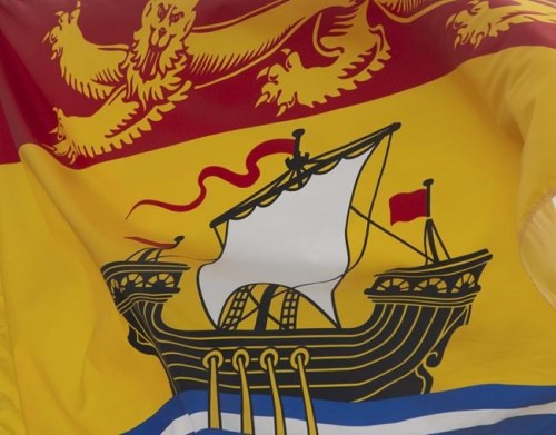 New Brunswick's provincial flag flies in Ottawa, Friday July 3, 2020. Nearly a year after New Brunswick businesses were required to have an operational plan in place to address the COVID-19 pandemic, compliance officers are still finding businesses with faulty plans or no plan at all. THE CANADIAN PRESS/Adrian Wyld