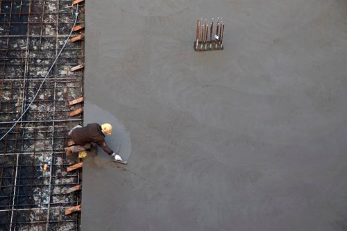 A worker smooths concrete at a housing development in Toronto, Thursday, Jan. 16, 2020. THE CANADIAN PRESS/Cole Burston