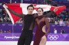 Ice dance gold medalists Canada's Tessa Virtue and Scott Moir skate with the Canadian flag during victory ceremonies at the Pyeongchang Winter Olympics on February 20, 2018 in Gangneung, South Korea. THE CANADIAN PRESS/Paul Chiasson