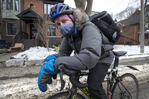 Uber Eats courier Spencer Thompson is shown in Toronto on Tuesday, February 2, 2021. THE CANADIAN PRESS/Frank Gunn
