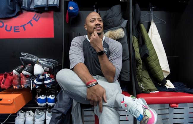 Montreal Alouettes' John Bowman sits in his locker as the team clean out their belongings in Montreal, Monday, Nov. 11, 2019. The Montreal Alouettes are parting ways with defensive end John Bowman after 14 CFL seasons. THE CANADIAN PRESS/Graham Hughes